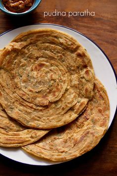 several flat breads on a white plate