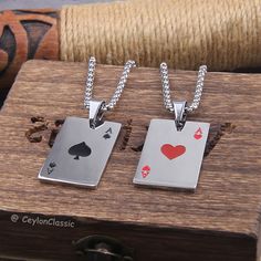 Elevate your style with our 2-piece Set Hip Hop Statement Stainless Steel Poker Card Ace of Hearts Necklace. Designed for both women and men, this unique pendant chain features the iconic Ace of Hearts, a symbol of power and mystique. Crafted from high-quality stainless steel, this necklace is built to last and will never fade, ensuring it remains a staple in your jewelry collection. Perfect for any poker enthusiast or fashion-forward individual, this necklace makes a bold statement and is a gre Poker Card, Ace Of Hearts, Power Symbol, Hearts Necklace, Classic Necklace, Poker Cards, Jewelry Bag, Black Jewelry, Unique Pendant