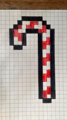 a piece of art made to look like an object with red and black squares on it