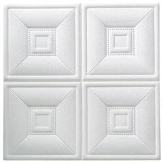 four square white tiles with stitching on them