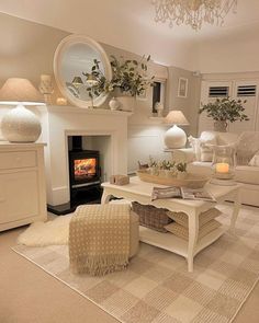 a living room filled with furniture and a fire place under a mirror on the wall