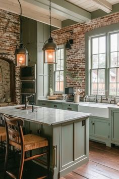 a large kitchen with an island in the middle and lots of windows on both sides