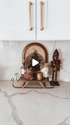 a kitchen counter top with christmas decorations on it