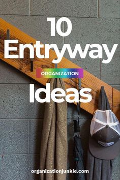 an entryway with umbrellas and hats hanging on the wall, next to a coat rack