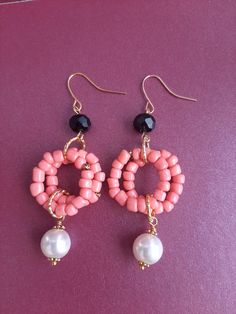 Peach pink dangle earrings made from glassbeads, black facetted glass bead and white faux pearl with golden earhooks and golden connectors Pink Earrings With Gold Beads, Pink And Gold Beaded Earrings, Pink Handmade Beaded Dangle Earrings, Pink Dangle Earrings With Gold Beads, Unique Pink Dangling Beaded Earrings, Peach Pink, Faux Pearl, Jewelry Earrings Dangle, Glass Beads