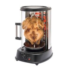 a chicken is being cooked in an electric blender with the lid open to show it's inside