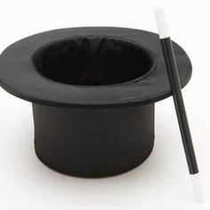 a black top hat with two chopsticks sticking out of it