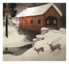 two deer are walking in the snow near a barn