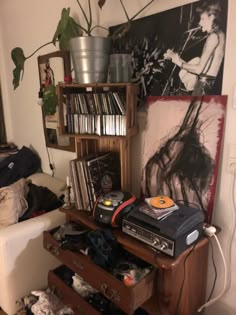 an old record player sits on top of a dresser