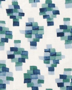 a white background with blue and green squares on the back of it's fabric