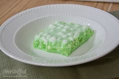 a piece of green cake on a white plate