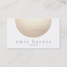 a white and gold business card with the words, annie barness your title on it