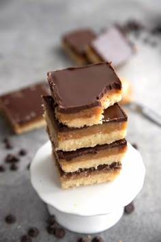 three pieces of cake sitting on top of a white plate