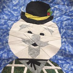 an animal made out of paper with a top hat