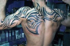 a man with a tattoo on his back