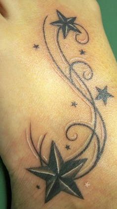 a star and swirl tattoo on the foot