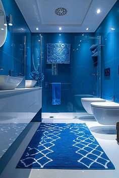 a bathroom with blue walls and white fixtures