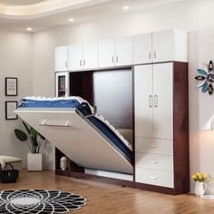 a bed that is in the middle of a room with a slide on it's side