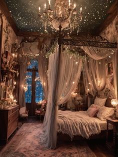 a bedroom with a canopy bed and chandelier hanging from it's ceiling