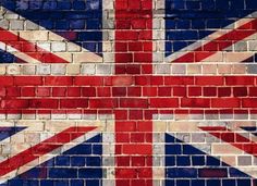 the british flag painted on a brick wall