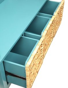 a blue dresser with wicker drawers on it's sides and one drawer open