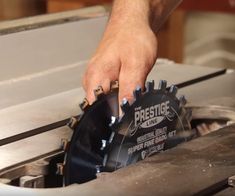 a person is working on something in a metal object that looks like a gear wheel