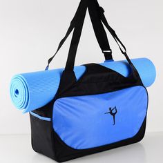 a yoga mat and gym bag sitting on top of each other