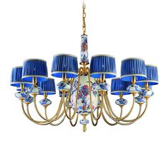 a blue and white chandelier with six lamps on each lamp shade is hanging from the ceiling