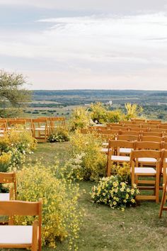 featuring a charming yellow floral aisle. Surrounded by lush greenery and breathtaking views, this setting is perfect for couples who dream of a romantic and serene outdoor wedding. The vibrant yellow flowers create a warm and inviting atmosphere, making your special day even more memorable. Walk down this picturesque aisle and say "I do" in a truly enchanting setting. Yellow Outdoor Wedding, Yellow Wedding Venue Decorations, Ceremony Meadow Arrangement, Ceremony Meadow, Wildflower Ceremony Installation, Yellow Floral Installation, Wedding Cermony, Field Wedding, Aisle Runner