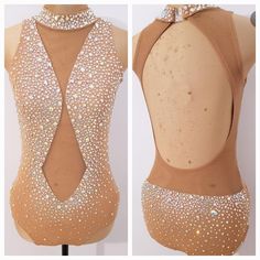 the back of a leotard with white beads on it and an open neckline