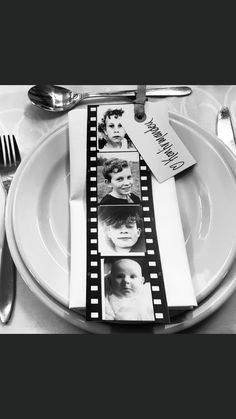 a white plate topped with silverware next to a couple of pictures on top of it