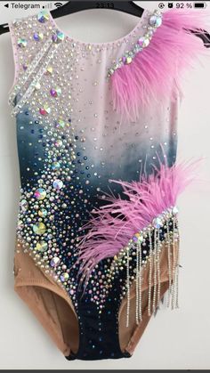 a bathing suit with feathers and beads on it