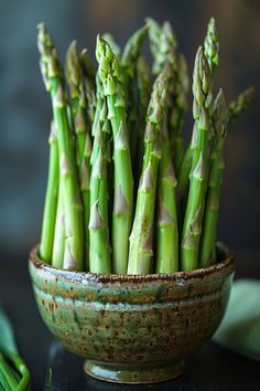 Fresh asparagus stalks arranged in a ceramic bowl. Recipes For The Oven