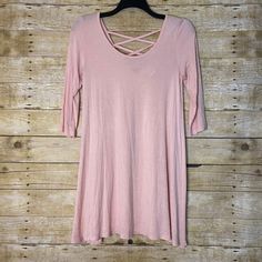 Women's vintage babydoll dress by Contempo Casuals from the 1990's.  This pale pink mini dress has a strappy back, scoop neck, and 3/4 length sleeves.  It is a rayon spandex blend.   The dress is a size medium.  It measures approximately: Armpit to armpit: 18 inches Waist: 40 inches Length: 35 inches The dress is in amazing vintage shape with no holes or blemishes. Vintage Babydoll Dress, Grunge Dress, Pink Mini, Pink Mini Dresses, Babydoll Dress, Dress Clothes For Women, Baby Dolls, Vintage Ladies, Scoop Neck