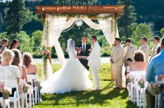 a bride and groom standing at the end of their wedding ceremony