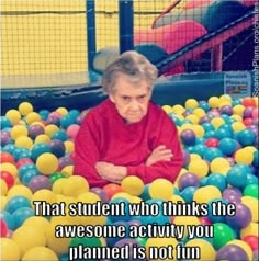 an old woman and man in a ball pit with the caption bazinga?