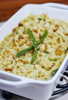 a casserole dish with asparagus and bread crumbs