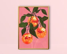 a mirror image of oranges hanging from a tree with green leaves and pink background