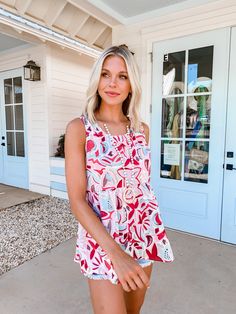 This tank is stunning! That abstract floral print is so fun and bold! It's going to look amazing with white jeans, shorts, or skirts! This babydoll tank is perfect for you and the warm summer weather! Trendy Printed Tank Top For Summer, Trendy Printed Summer Tank Top, Trendy Summer Printed Tank Top, Red Spring Vacation Top, Red Spring Vacation Tops, Summer Printed Tank Top For Day Out, Playful White Tank Top For Spring, Printed Summer Tank Top For Day Out, Red Summer Top For Day Out