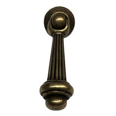 an antique brass door handle on a white background