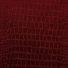 the texture of an alligator skin pattern in red