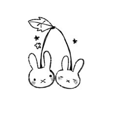 two bunnies are sitting next to each other on a white surface with stars in the background