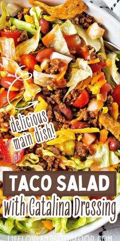 a taco salad with lettuce, tomatoes and other toppings in a white bowl