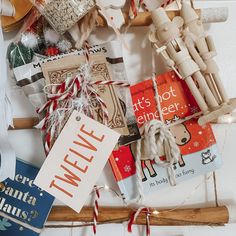 a bunch of christmas items are laying out on the floor next to each other and tied with twine