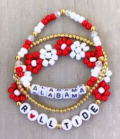 Alabama Bracelets  ❤️❤️ Are you ready for some football?? 🏈 Get game day ready with this cute football stack!! Mix and match or buy bracelets individually. Made with 4mm seed beads, 18k gold filled beads and small square 4mm letter beads.  CARING TIPS FOR YOUR JEWELRY ⭐️Treat and store with care. ⭐️ For longevity, avoid exposing your jewelry to water. ⭐️ Avoid having direct contact with lotions, perfumes, sanitizers as these chemicals may cause discoloration of your jewelry. Adjustable White Bracelets For Team Events, White Team Spirit Stretch Bracelet As Gift, White Team Spirit Stretch Bracelet, Personalized White Beaded Bracelets For Football Season, Game Day Jewelry, Personalized White Bracelets For Football Season, Alabama Beaded Bracelets, Gameday Bracelets, Game Day Bracelet Stacks