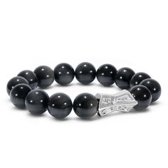 Unveiling a masterpiece that seamlessly blends the mystique of the Viking era with modern elegance. Our 12mm gemstone beaded bracelet features a sterling silver charm, intricately designed with Runes of Victory, Success, and Wealth. Whether you're dressing for a special occasion or elevating your daily style, this bracelet resonates with the warrior within. Feel the unity of Earth, Sky, and Sea with every wear. Black Obsidian Beads Experience the deep black luster that adds a touch of sophistica Sky And Sea, Meteorite Jewelry, Warrior Within, Obsidian Bracelet, Trinity Knot, The Warrior, Matching Jewelry, Gemstone Beaded Bracelets, Men's Jewelry Rings