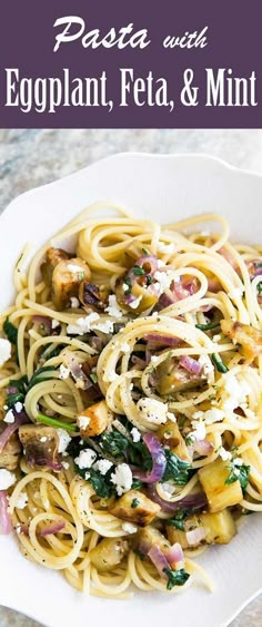 pasta with eggplant, feta and mint on a white plate