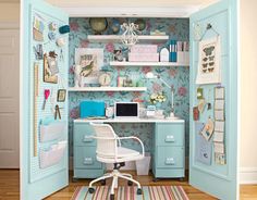 an open door shows a desk and chair in a room with wallpaper on the walls