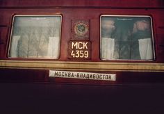 two windows on the side of a train car that reads mck 4335, moscow - branebooth