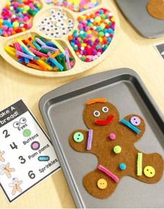 a cookie sheet with buttons on it next to some crafting supplies